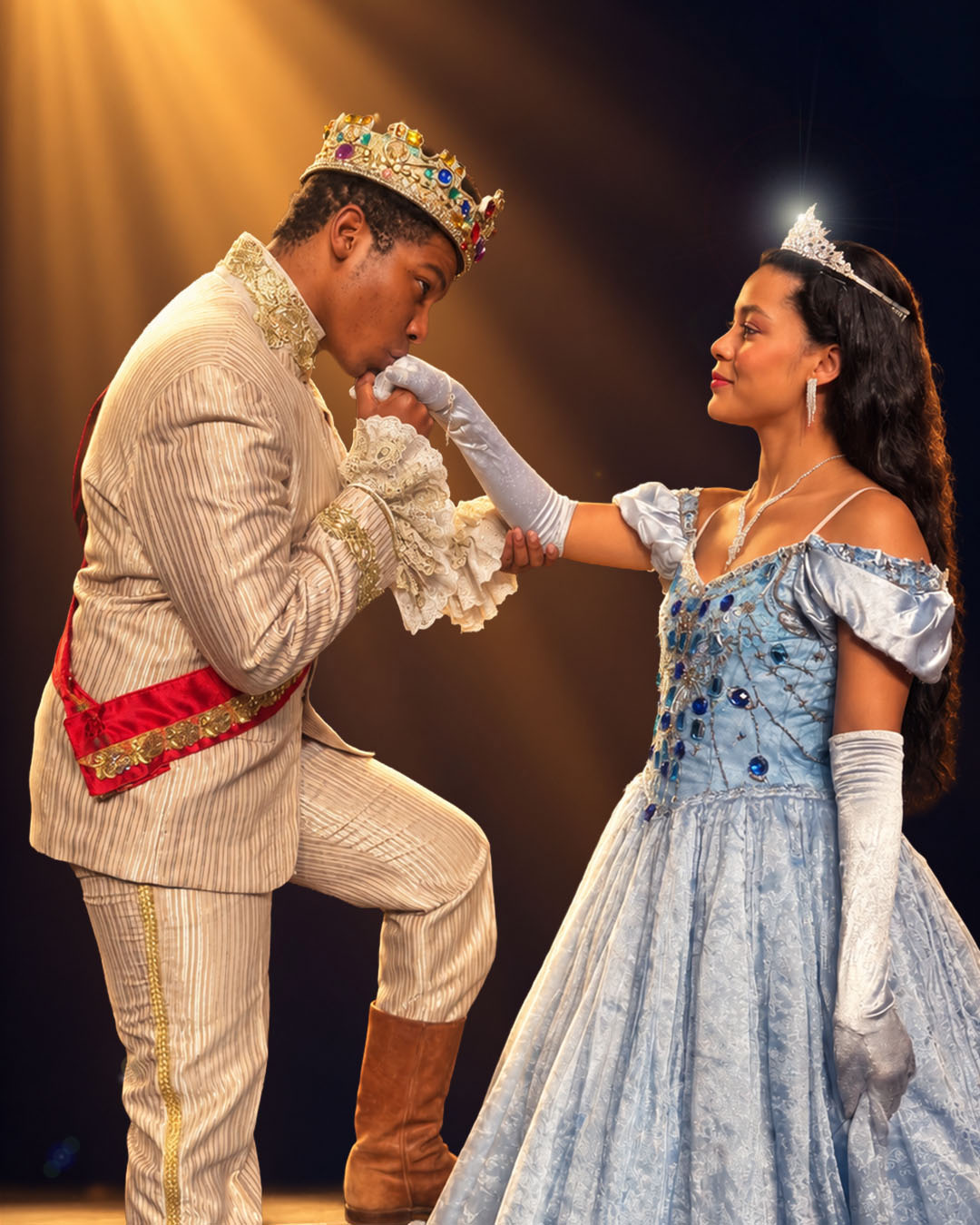 Tumelo Mogashoa as Prince Perrault kisses the hand of Gabrielle De Gama as Princess Aurora